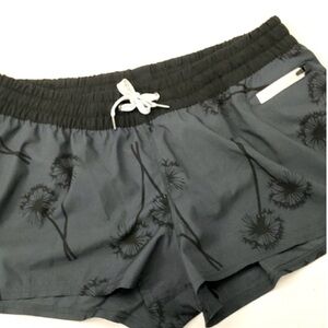 Vuori Women's Dark Gray Athletic Shorts with Black Floral Print